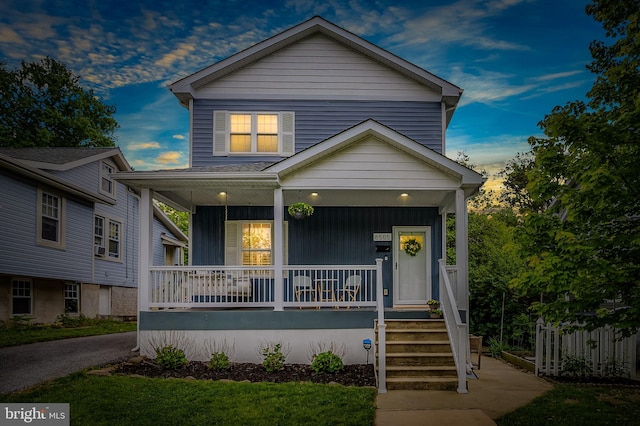 view of front of house with covered porch and board and batten siding