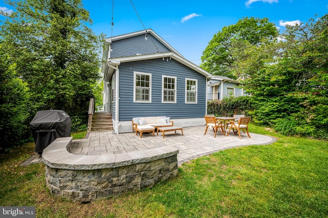 rear view of property featuring a patio area, a lawn, and an outdoor living space