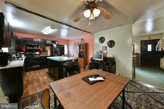 dining space with ceiling fan and light wood-style floors