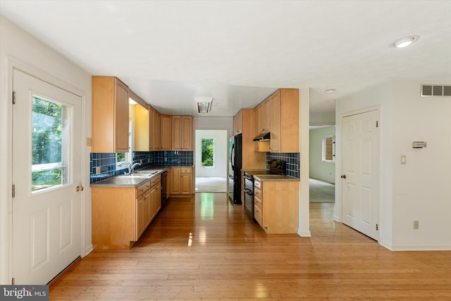 112 Old Forest Cir, Winchester, VA 22602 - kitchen with black appliances, backsplash, a sink, and light wood-style flooring