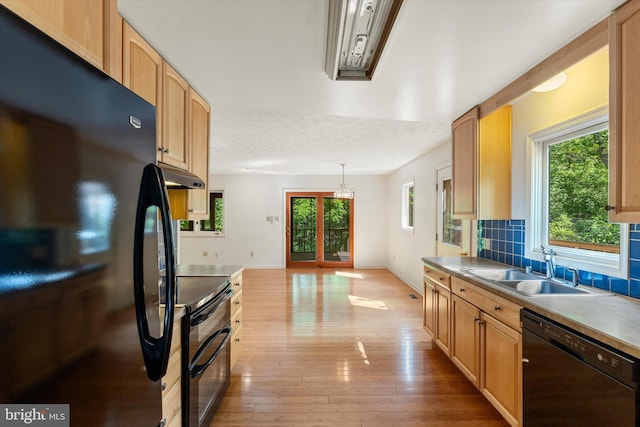 112 Old Forest Cir, Winchester, VA 22602 - kitchen with black appliances, a sink, plenty of natural light, and under cabinet range hood
