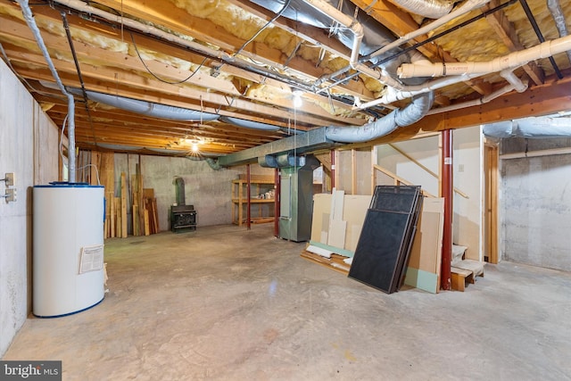 112 Old Forest Cir, Winchester, VA 22602 - unfinished basement with water heater, a wood stove, heating unit, and stairs