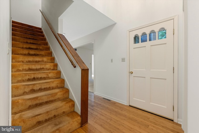 112 Old Forest Cir, Winchester, VA 22602 - foyer entrance with light wood-style floors, stairway, and baseboards