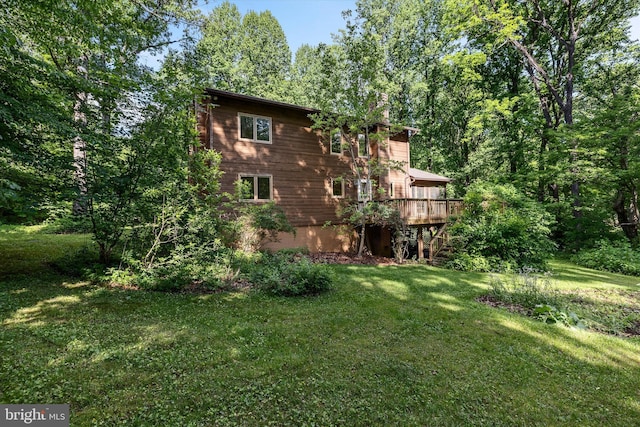 112 Old Forest Cir, Winchester, VA 22602 - back of property with a deck, a lawn, and a chimney