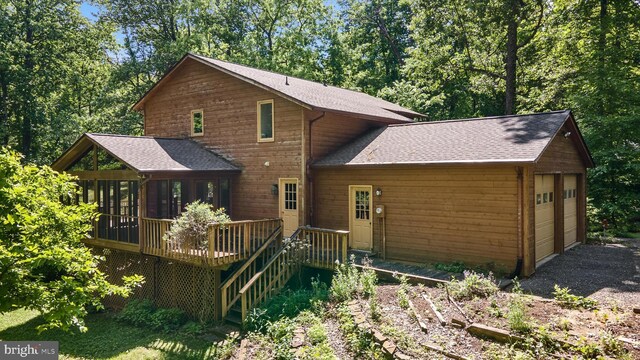 112 Old Forest Cir, Winchester, VA 22602 - rear view of house with a sunroom, a shingled roof, a garage, and a wooden deck