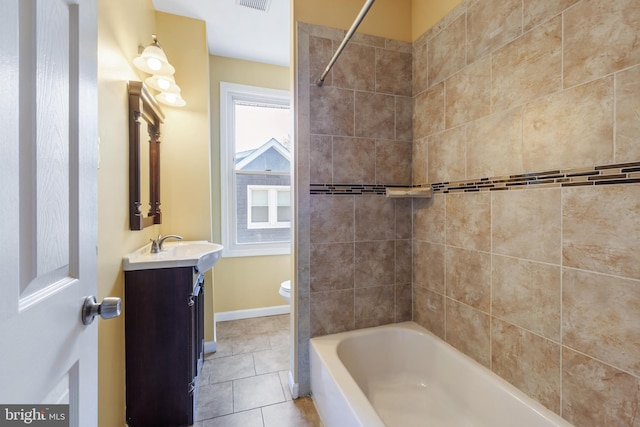 full bathroom with toilet, vanity, visible vents, tile patterned floors, and baseboards