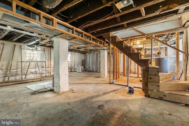below grade area with water heater and stairway