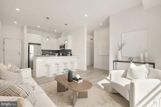 1001 Rhode Island Ave NE Unit 204, Washington, DC 20018 - living room with light wood-style floors, recessed lighting, and baseboards