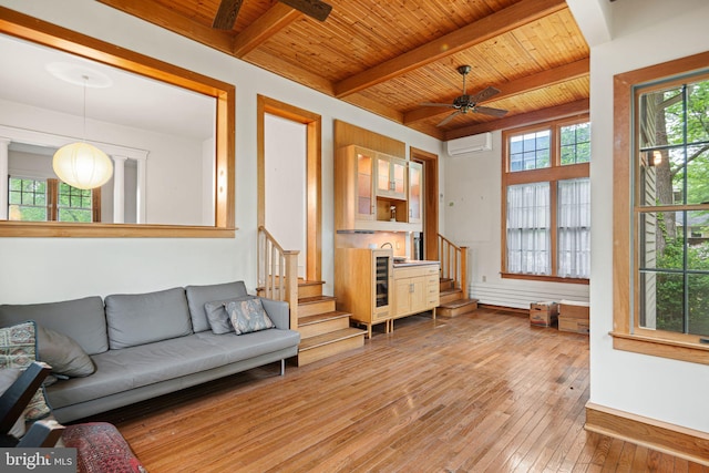 living room featuring an AC wall unit, wooden ceiling, stairs, ceiling fan, and hardwood / wood-style floors