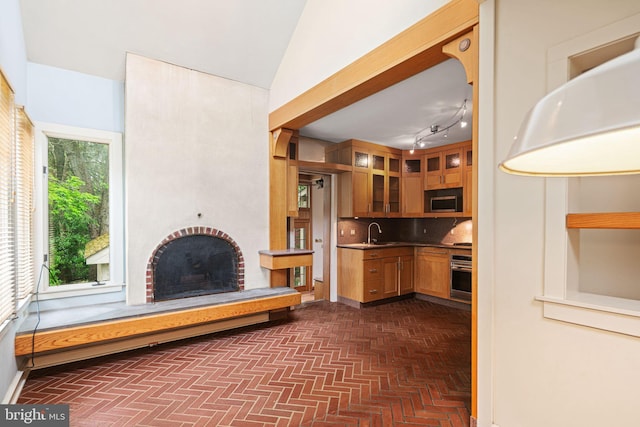 unfurnished living room with a sink and a fireplace