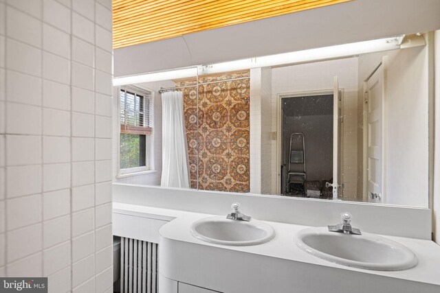 bathroom featuring double vanity