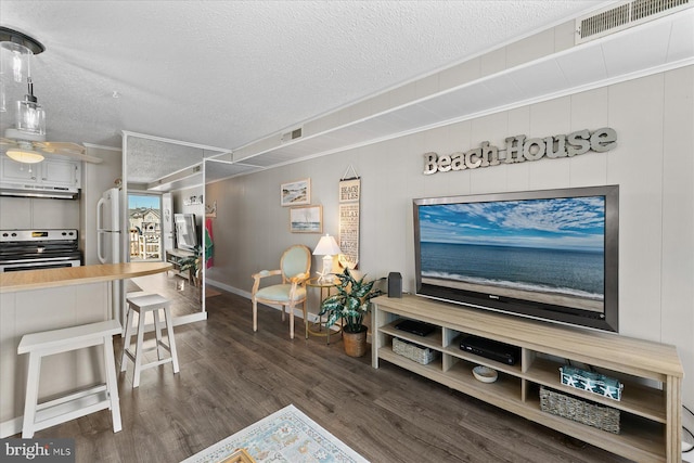 17 143rd St Unit 302, Ocean City, MD 21842 - living area with a textured ceiling, dark wood-type flooring, crown molding, and baseboards