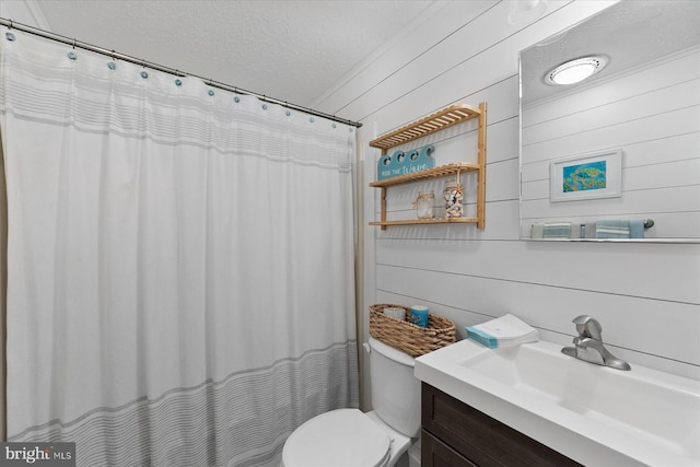 17 143rd St Unit 302, Ocean City, MD 21842 - full bathroom featuring a textured ceiling, vanity, toilet, wooden walls, and a shower with curtain