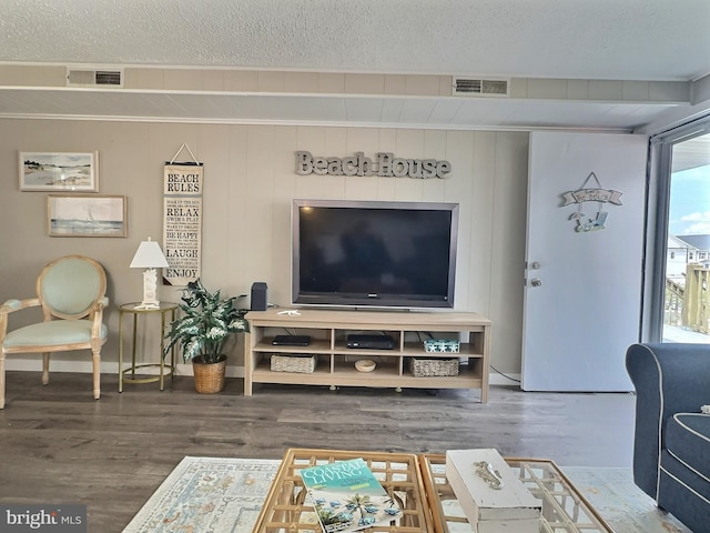 17 143rd St Unit 302, Ocean City, MD 21842 - living area featuring a textured ceiling, visible vents, and wood finished floors