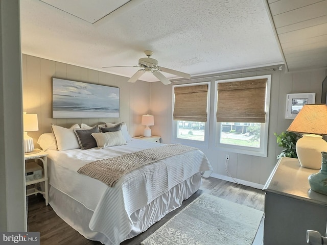 17 143rd St Unit 302, Ocean City, MD 21842 - bedroom with baseboards, ceiling fan, a textured ceiling, and wood finished floors