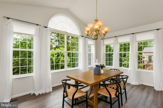 sunroom / solarium with french doors, vaulted ceiling, a chandelier, and plenty of natural light
