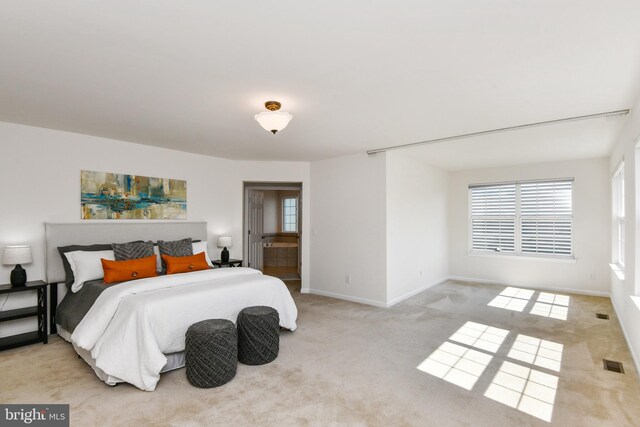 bedroom with carpet and baseboards