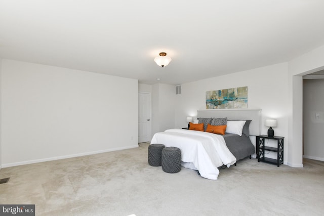bedroom with carpet flooring and baseboards