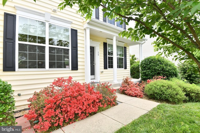 property entrance with covered porch