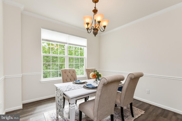 dining space with a chandelier, crown molding, dark wood finished floors, and baseboards