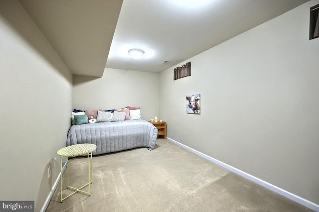 bedroom with carpet flooring and baseboards