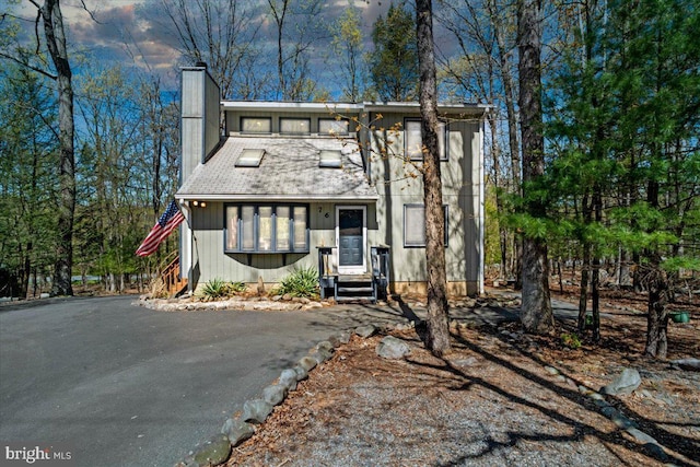 249 Hyland Dr, East Stroudsburg, PA 18301 - view of front of house featuring a chimney and entry steps