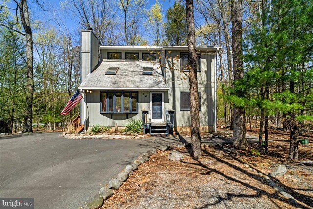 249 Hyland Dr, East Stroudsburg, PA 18301 - view of front of home featuring a chimney and entry steps