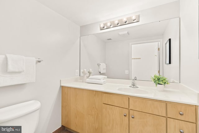 616 E St NW Unit 447, Washington, DC 20004 - bathroom with toilet, vanity, and visible vents
