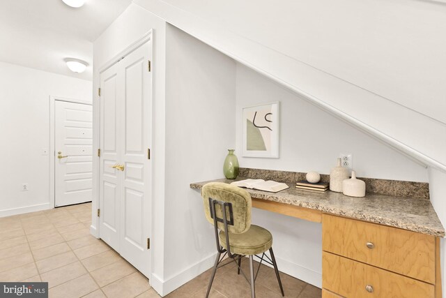 616 E St NW Unit 447, Washington, DC 20004 - office area featuring light tile patterned floors, baseboards, and built in study area
