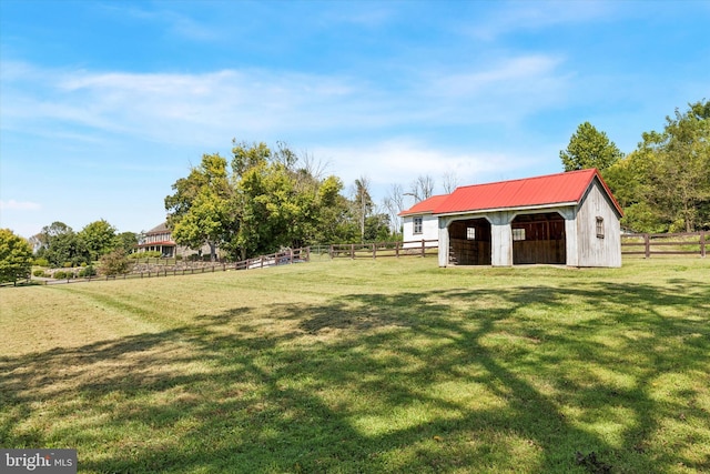 275 S Creek Rd, West Chester, PA 19382 - view of yard featuring an outdoor structure, a garage, and an exterior structure