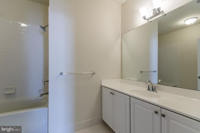 bathroom with vanity, baseboards, bathing tub / shower combination, and tile patterned floors