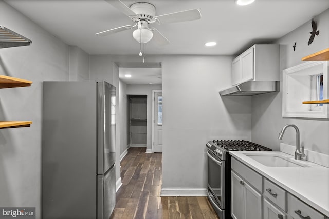 418 Vine St, Camden, NJ 08102 - kitchen with appliances with stainless steel finishes, a sink, under cabinet range hood, a ceiling fan, and dark wood finished floors