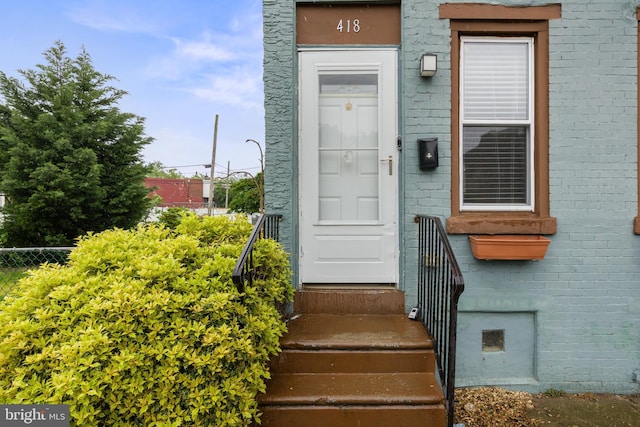 418 Vine St, Camden, NJ 08102 - entrance to property with fence and brick siding