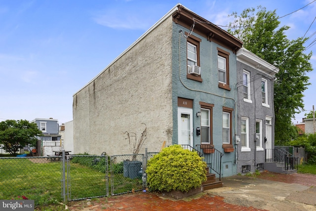 418 Vine St, Camden, NJ 08102 - view of front of house with a gate, stucco siding, and cooling unit