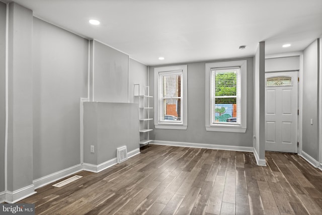 418 Vine St, Camden, NJ 08102 - unfurnished living room with dark wood-type flooring and baseboards