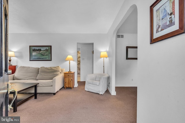 1545 Maple Ave, Haddon Heights, NJ 08035 - living area with arched walkways, carpet flooring, and baseboards