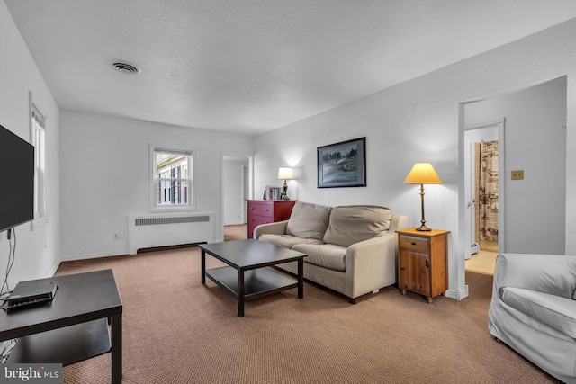 1545 Maple Ave, Haddon Heights, NJ 08035 - living area with radiator heating unit, light colored carpet, baseboard heating, and baseboards