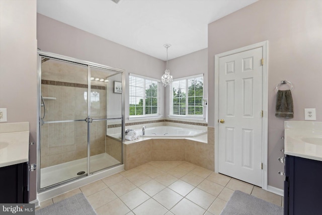 full bath featuring vanity, a stall shower, tile patterned flooring, and a garden tub