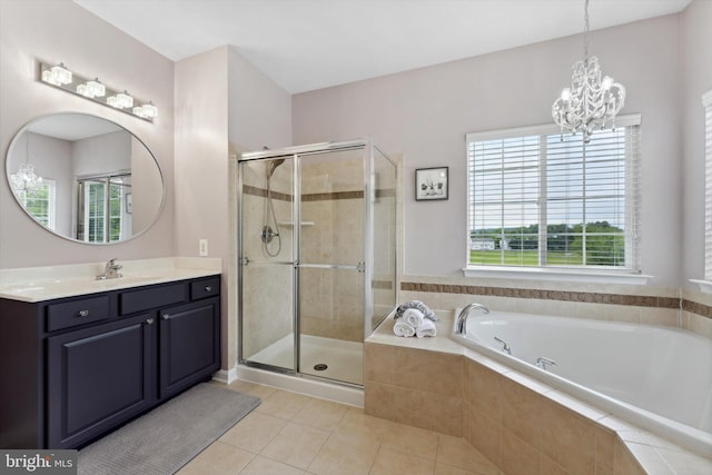 full bathroom featuring a chandelier, a shower stall, tile patterned flooring, and a garden tub