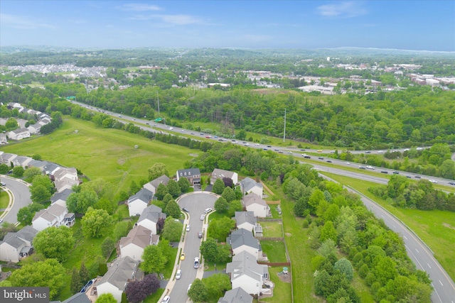 aerial perspective of suburban area with a tree filled landscape