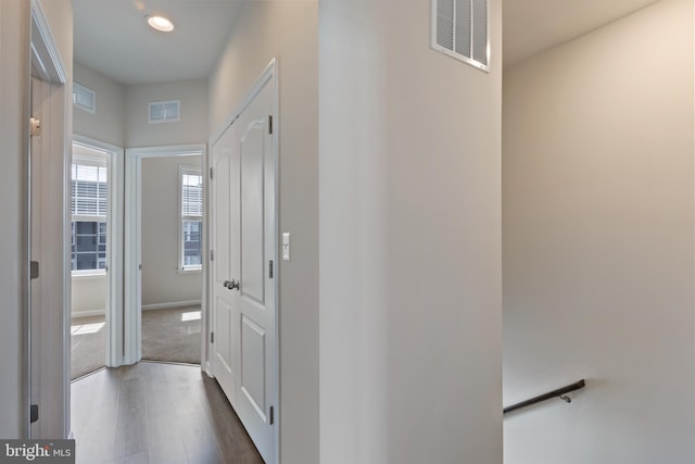 hall with baseboards, dark wood-style flooring, and recessed lighting