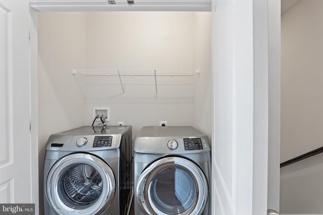 laundry room featuring separate washer and dryer