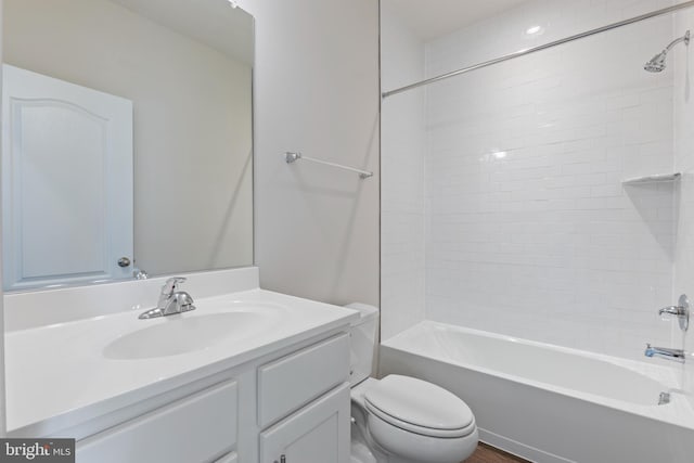 full bathroom with toilet, vanity, and tub / shower combination