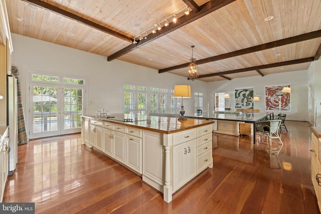 1129 Delaplane Grade Rd, Upperville, VA 20184 - kitchen featuring french doors, hardwood / wood-style floors, a wood ceiling with exposed beams, a center island, and black electric stovetop