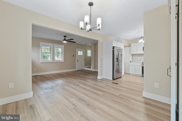 2701 Christopher Ave, Baltimore, MD 21214 - unfurnished living room featuring a chandelier, a ceiling fan, and light wood-type flooring
