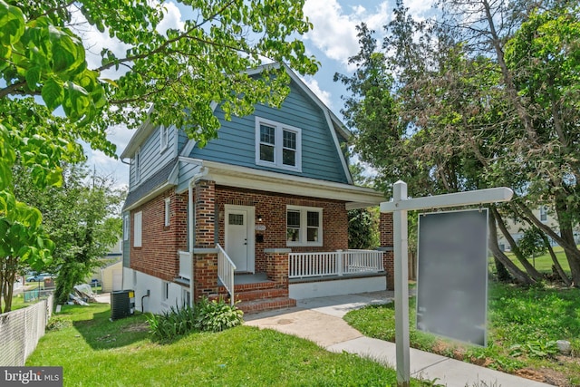 2701 Christopher Ave, Baltimore, MD 21214 - view of front of property featuring covered porch and brick siding