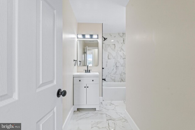 2701 Christopher Ave, Baltimore, MD 21214 - bathroom with marble look tiles, vanity, and shower / bathtub combination