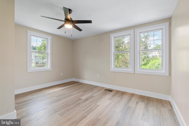 2701 Christopher Ave, Baltimore, MD 21214 - empty room with light wood finished floors and a ceiling fan