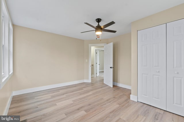 2701 Christopher Ave, Baltimore, MD 21214 - unfurnished bedroom with light wood finished floors, a closet, and a ceiling fan
