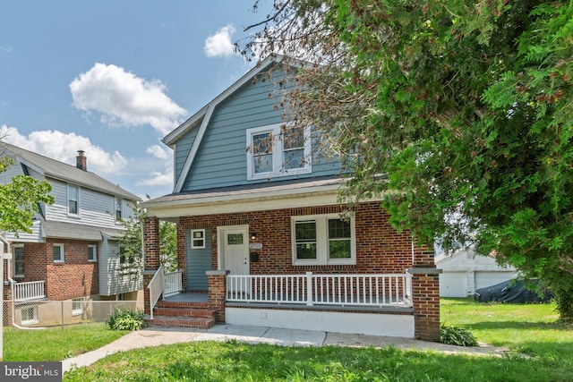 2701 Christopher Ave, Baltimore, MD 21214 - dutch colonial with covered porch, brick siding, a gambrel roof, and a front lawn